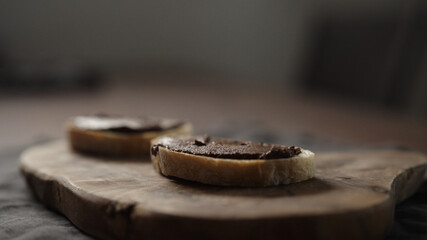 chocolate spread on ciabatta slice on dining table
