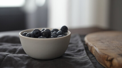 washed blueberries in white bowl on table