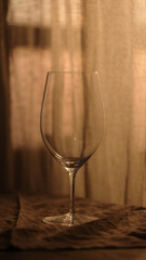 empty wineglass with sunset light