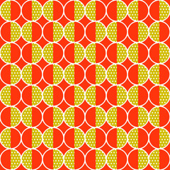 Orange background and yellow halves of a circle. The other halves are white polka dots.
