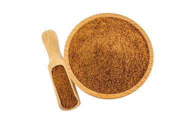 coconut sugar in wooden bowl and scoop isolated on white background.Spice and food ingredients.