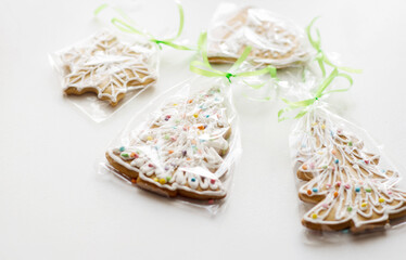 Fototapeta na wymiar Four christmas gingerbread cookies individual packaging