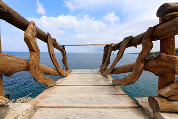 limited wooden bridge over the sea