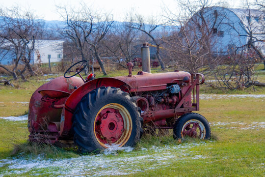 Very old tractor in a farm on the canadian countryside