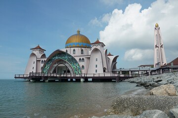 view of Malacca Straits Mosque against blue sky