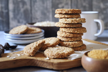 Crispy oatmeal cookies with unrefined brown sugar and cup of coffee