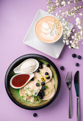 Dumplings with white cheese and blueberries, delicious and healthy dinner or dessert.