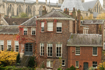 Old traditional British brick manor in front of York Minster in York England