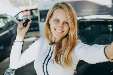 Woman happy just bought her new car