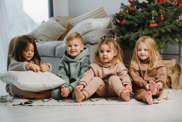 Group of four children with presents on Christmas party