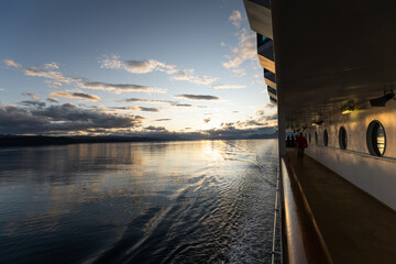 Sunset on ocean from outer deck of ship