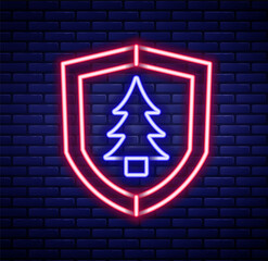 Glowing neon line Shield with tree icon isolated on brick wall background. Eco-friendly security shield with tree. Colorful outline concept. Vector