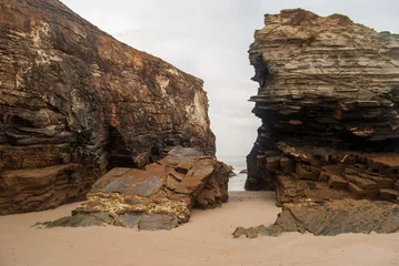Fotobehang Eroded rock walls on the beach of the cathedrals. © Jhony