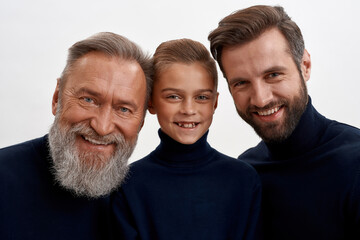 Portrait of happy three generations of men together