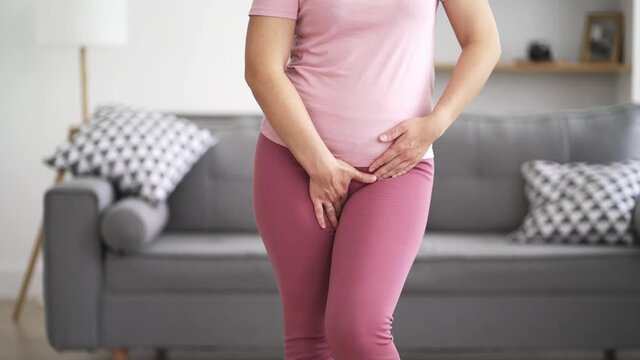 Menstrual pain, woman with stomachache suffering from pms at home, endometriosis, cystitis and other diseases of the urinary system, health problems concept