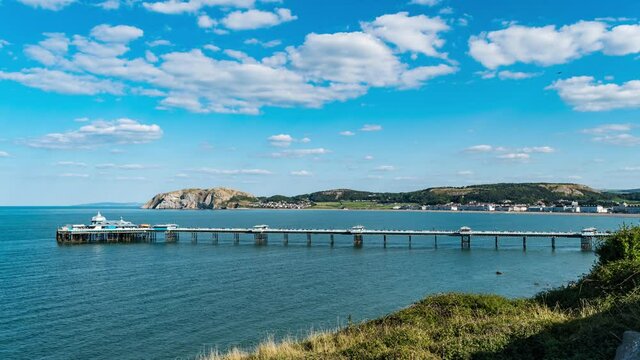Llandudno, Wales Conwy County Borough, Wales, located on the Creuddyn peninsula, Near Great Orme, United Kingdom Time lapse Pier beach