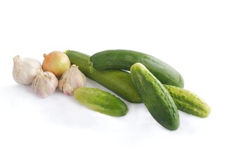 green,fresh cucumbers,onions and garlic as wholesome vegetables