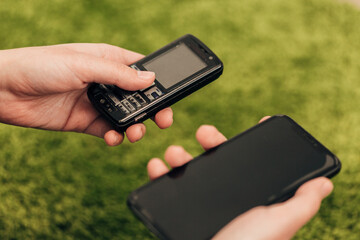 The Human Hand Choosing Phone That Lies Near New Smartphones