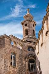 Fototapeta na wymiar Detail of the bell tower of the Cathedral of Monopoli in Puglia (Italy)