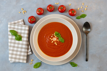 tomato soup with basil on a plate, homemade and fresh
