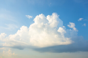 A lonely cumulus cloud reborn as a thunderstorm in the summer sky.