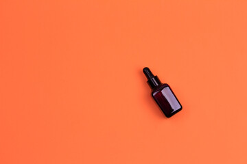 Swing top glass bottle with organic cranberry juice with lot of berries on wooden background. Healthy lifestyle concept