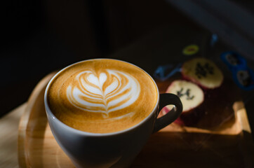 Coffee latte art on wooden table