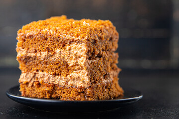 honey cake biscuit with cream sweet dessert meal snack on the table copy space food background rustic. top view