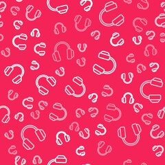 White line Headphones icon isolated seamless pattern on red background. Earphones. Concept for listening to music, service, communication and operator. Vector
