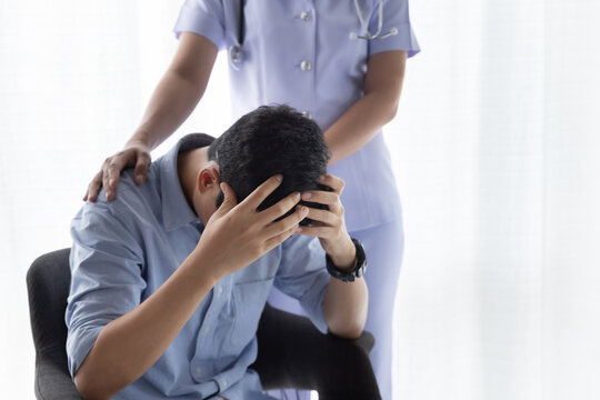 Patient Receiving Bad News. Female Nurse Give Encouragement & Console Worrying Patient.