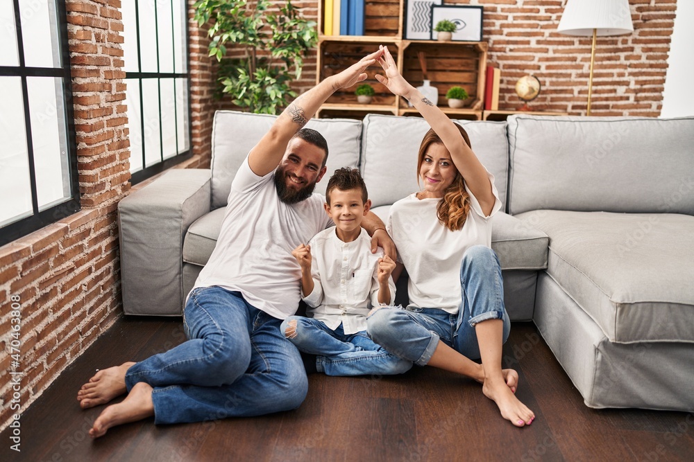 Wall mural family of three doing house shape with arms screaming proud, celebrating victory and success very ex