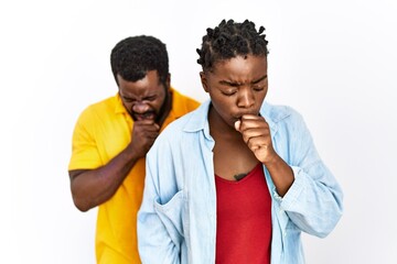 Young african american couple wearing casual clothes feeling unwell and coughing as symptom for cold or bronchitis. health care concept.