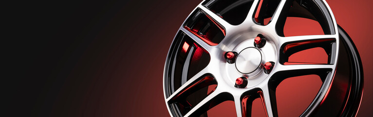 The new automotive alloy wheel is light and sporty red with shiny spokes on a red-black gradient...