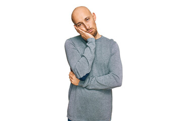 Bald man with beard wearing casual clothes thinking looking tired and bored with depression problems with crossed arms.