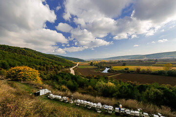 Naklejka premium Winding magnificent mountain and cloudy road on the decked road, Beehives