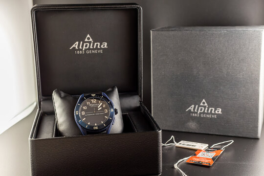 Frankfurt, Germany - November20th 2021: A german photographer unboxes his new hybrid watch Alpina AlpinerX Alive and takes pictures of it and the box and equipment.