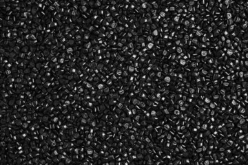 Many black and gray granules of polypropylene, polyamide. Background. Plastic and polymer industry,...