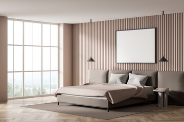 Corner of beige bedroom with horizontal canvas on wall