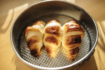 Freshly baked croissants. Baking on the table
