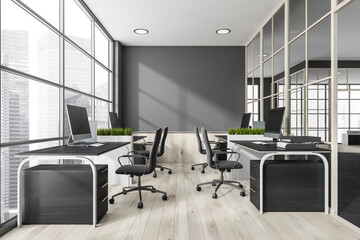 Grey and white wood panoramic space with four office desks