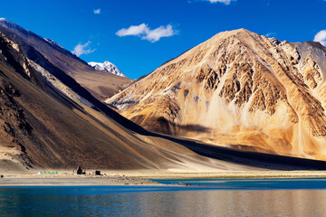 Scenic beauty of Mountains and Pangong tso Lake, blue sky and Himalayan mountains in background, Leh,Ladakh,Jammu and Kashmir,India