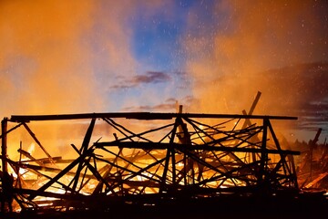 Burning wooden buildings close-up. Raging flames of fire. Firestorm closeup. Building is on fire....