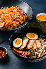 Traditional Chinese or Thai food set. Chinese noodles, fried rice with chicken, tom yum soup,deep fried fish and udon with shrimps. Asian style food concept.