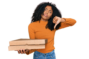 Young african american girl holding delivery pizza box with angry face, negative sign showing...
