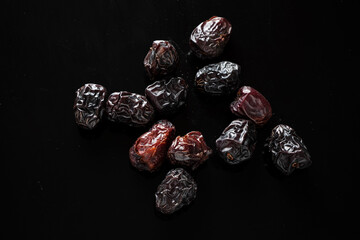 date fruits on the black background