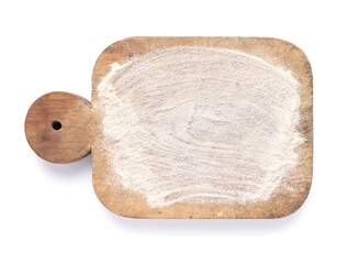 Wooden cutting board and scattered flour powder isolated at white background