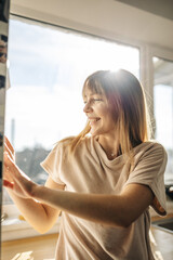 woman looking out window