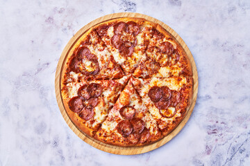  Delicious pepperoni italian pizza on a marble surface