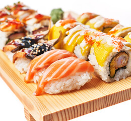  Wooden board of sushi food isolated on white background