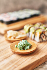  Wooden board of shrimp and cheese cream uramaki sushi on a wooden surface